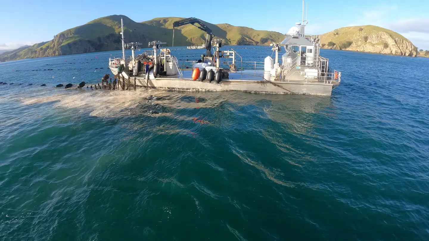 Seafood aquaculture vessel at work