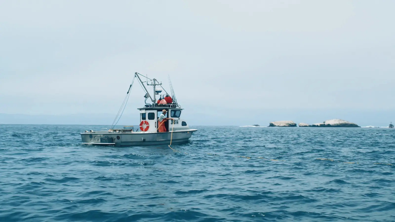 Crew working on the stern of a New Zealand fishing vessel
